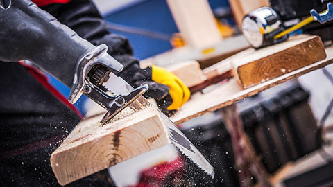 A close view of a power saw cutting wood