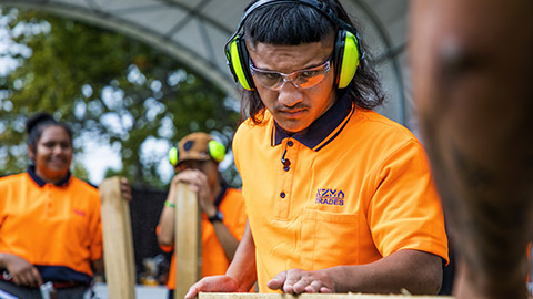 A tradie wearing safety glasses on the job