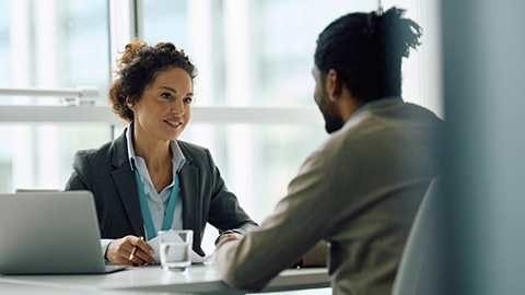 Two people talking in an office