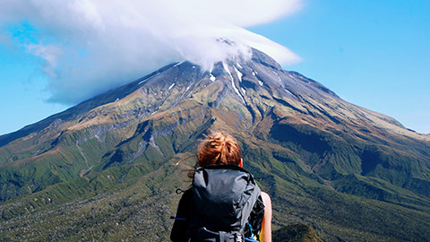 A person looking at a mountain