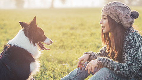 A girl talking to her dog