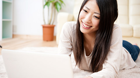 A person typing on a laptop