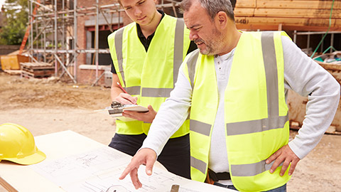 A supervisor talking to an apprentice