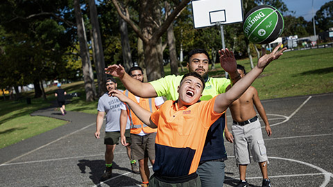 A group of workers enjoying a game of basketball