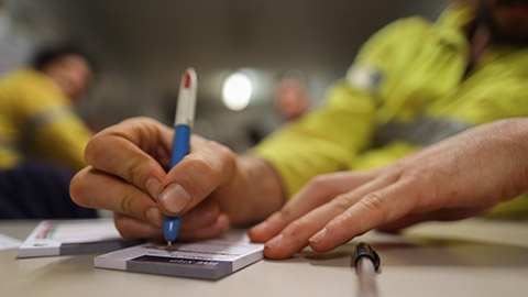 A worker filling out paperwork