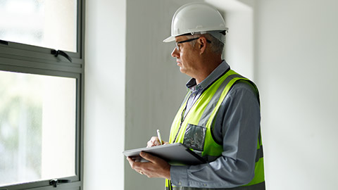 A site manager inspecting construction