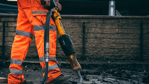 A person wearing hi-vis on a work site