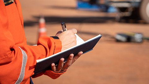 A person filling in paperwork