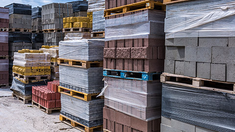 Pallets of bricks stacked on a worksite