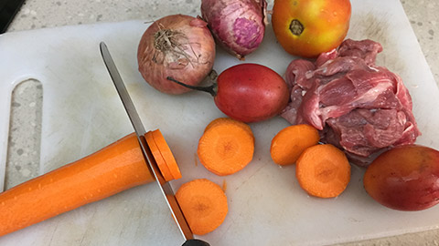 meat and veggies on a cutting board