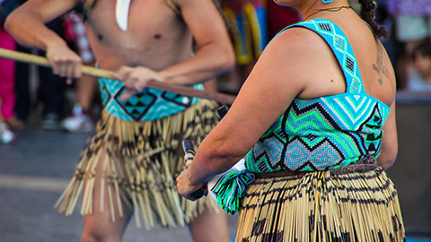 People wearing traditional clothes in a ceremony