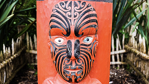 Maori red carving of a face