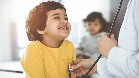 A child getting examined by a doctor