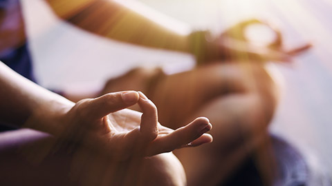 A close view of a person meditating