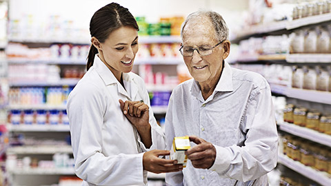 A pharmacist guiding a client on what the medicine to purchase