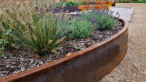 A rusty border around a garden bed