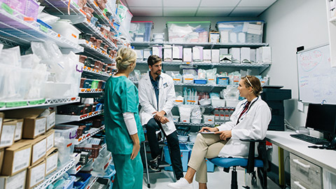 Pharmacists talking in an office