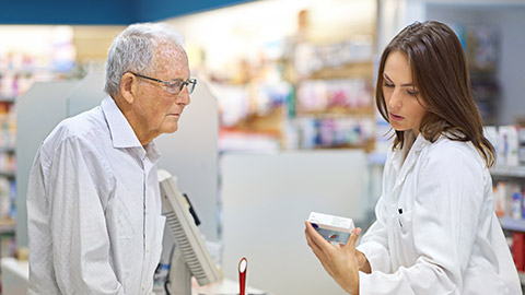 A pharmacist with a client