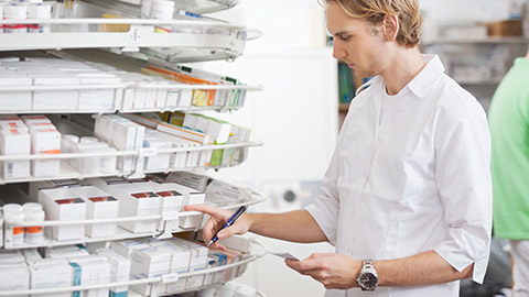 A chemist dispensing drugs