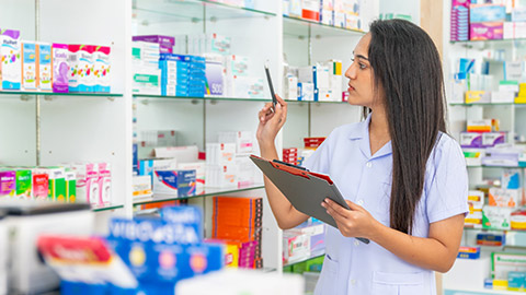 A pharmacist counting stock