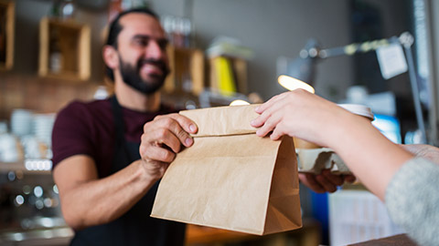 A barista serving a customer