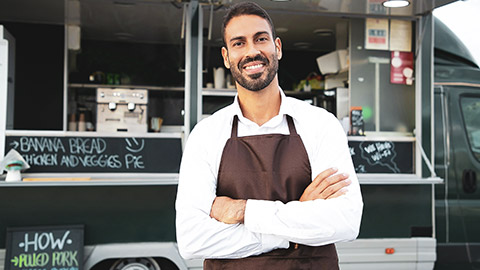 A food truck owner outside his truck