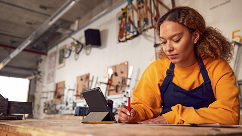 a female business owner working and planning about her business