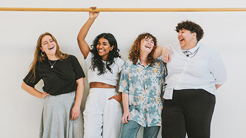 A group of teenagers laughing and joking around