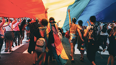 A group of youths participating in a pride march