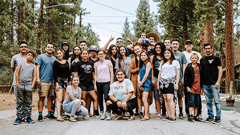 A group of teen at an outdoor campsite