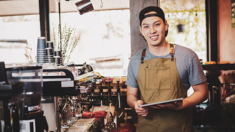 A teenage barista working in a cafe