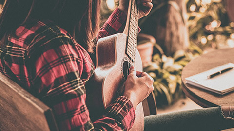 Close view of a youth working chilling and playing some tunes