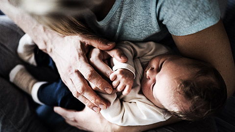 A person holding a baby