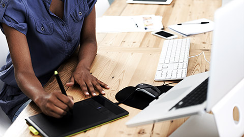 A person using a computer to design