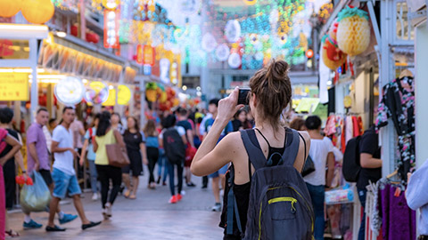 Tourist woman on public market