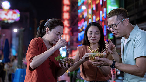 Asian people eating street food