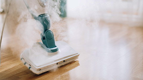 Steam cleaner mop cleaining floor