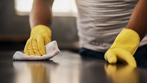 leaning gloves and wipe on a table with a wash cloth