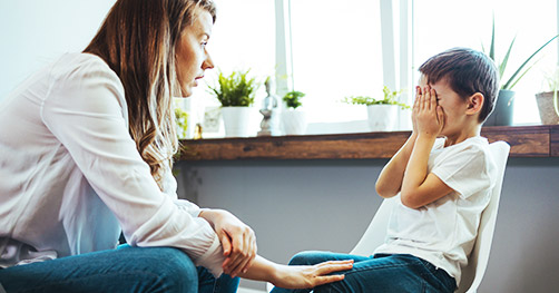 an educator consoling a student