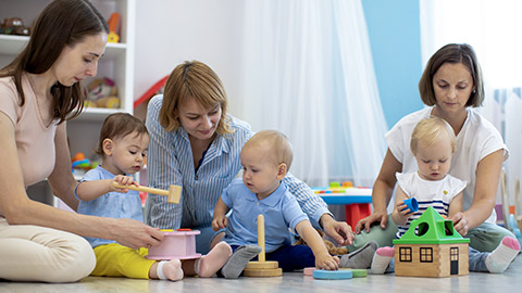 Moms playing with toddlers