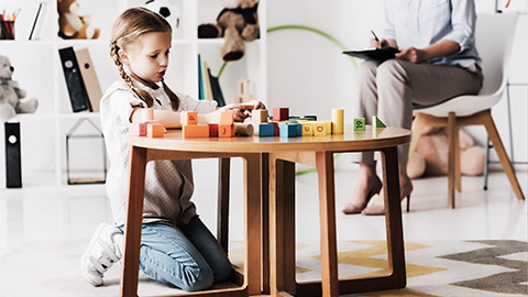 an early childhood professional observing a student