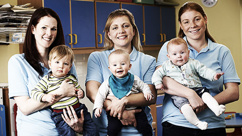 Three childcare professionals handling infants correctly