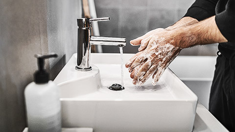 A person washing their hands