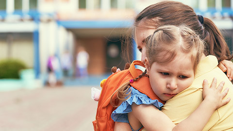 mother accompanies the child to school