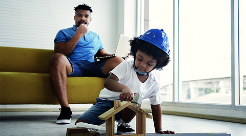 A child playing with a helmet