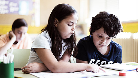 A couple of children interacting with each other