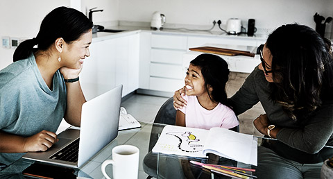 A child professional talking to a child and parent