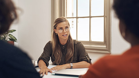 A HR manager discussing an issue with employees