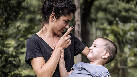 Woman child caring a boy