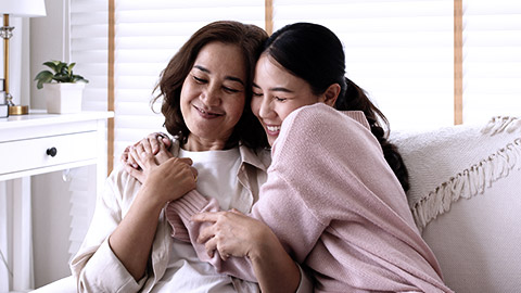 Daugther hugging her mom